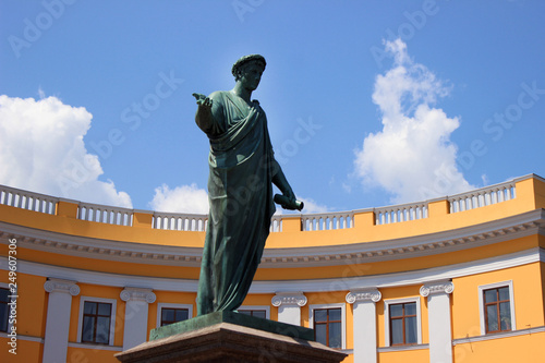 Duke Richelieu in Odessa - the famous monument near the Potemkin stairs, on the background of the building and the blue sky photo