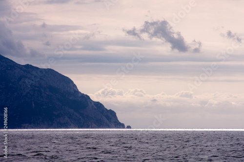 Landscape with water boat and land in the background - Aegean sea  Greece