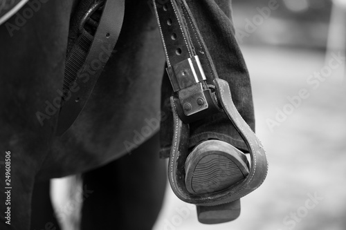 close up of a cowboy's boot in a stirrup