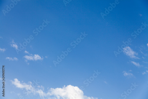 Clean Bright Blue Sky with Fluffy Clouds