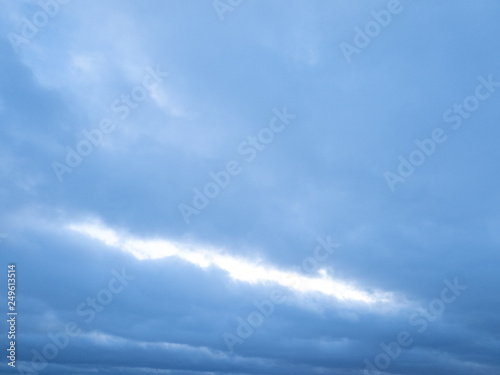 Сlouds in winter on the horizon of a frozen lake.