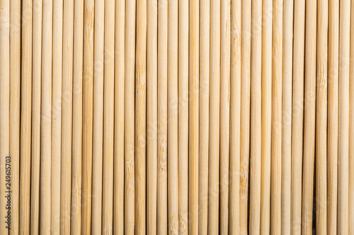 Fototapeta Naklejka Na Ścianę i Meble -  Round wooden sticks background. Close-up Wall Pattern
