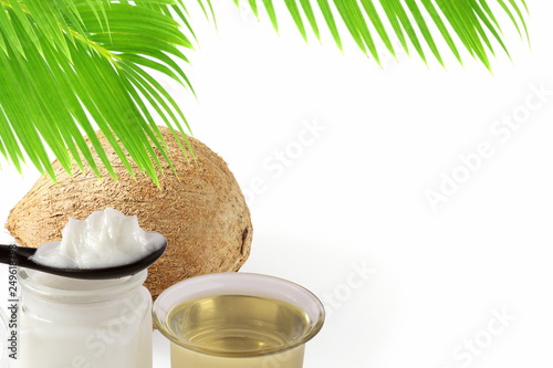 coconut fruit whole and cut with coconut leaves in white background