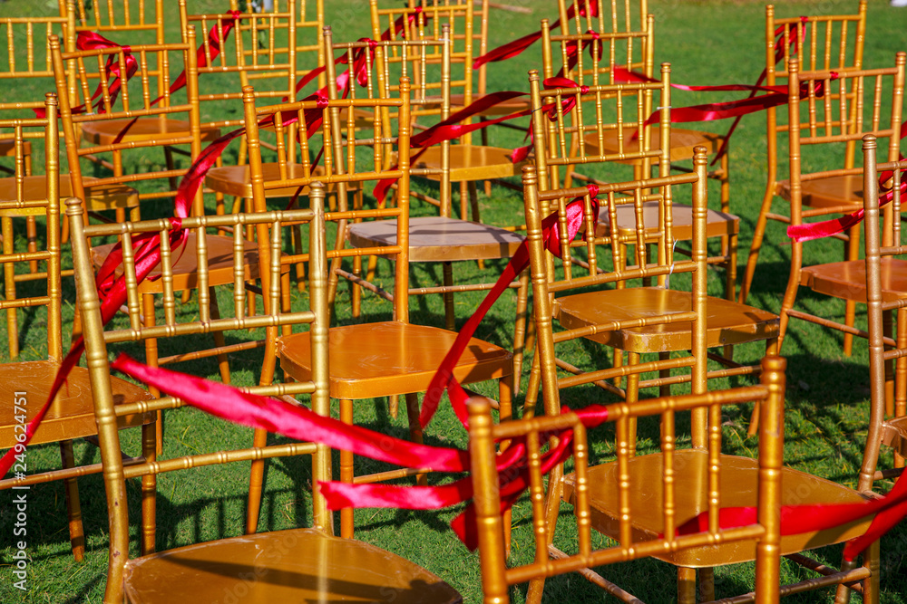 wedding ceremony, chairs decorated with roses