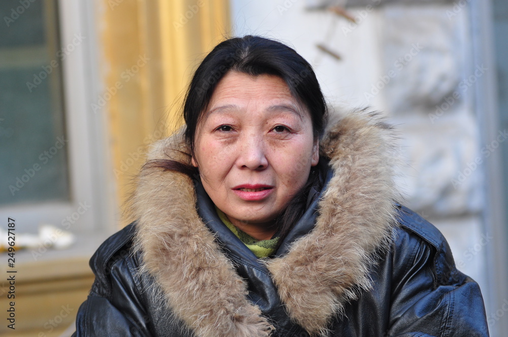 A middle-aged Asian woman A middle-aged Asian woman