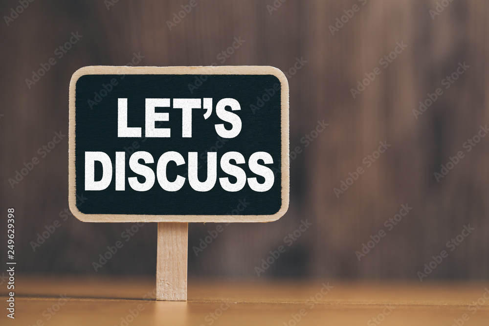 Conceptual Chalkboard Showing Let Us Discuss