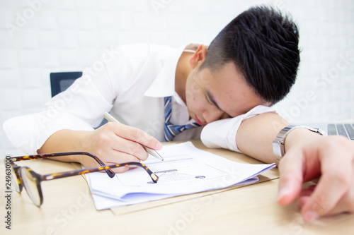 Office worker tired after continuous over time working.
