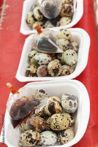 Quail eggs with sauce in street food