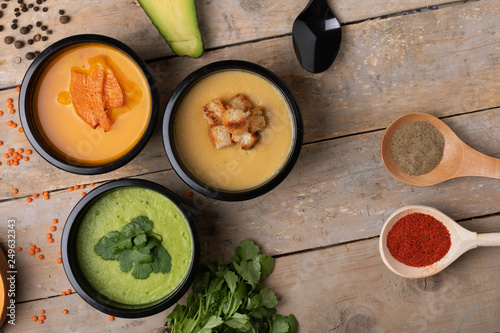 Steaming chikpea, lentil cream soup, Vegetarian homemade food concept, healthy eating. Kid holding spoon