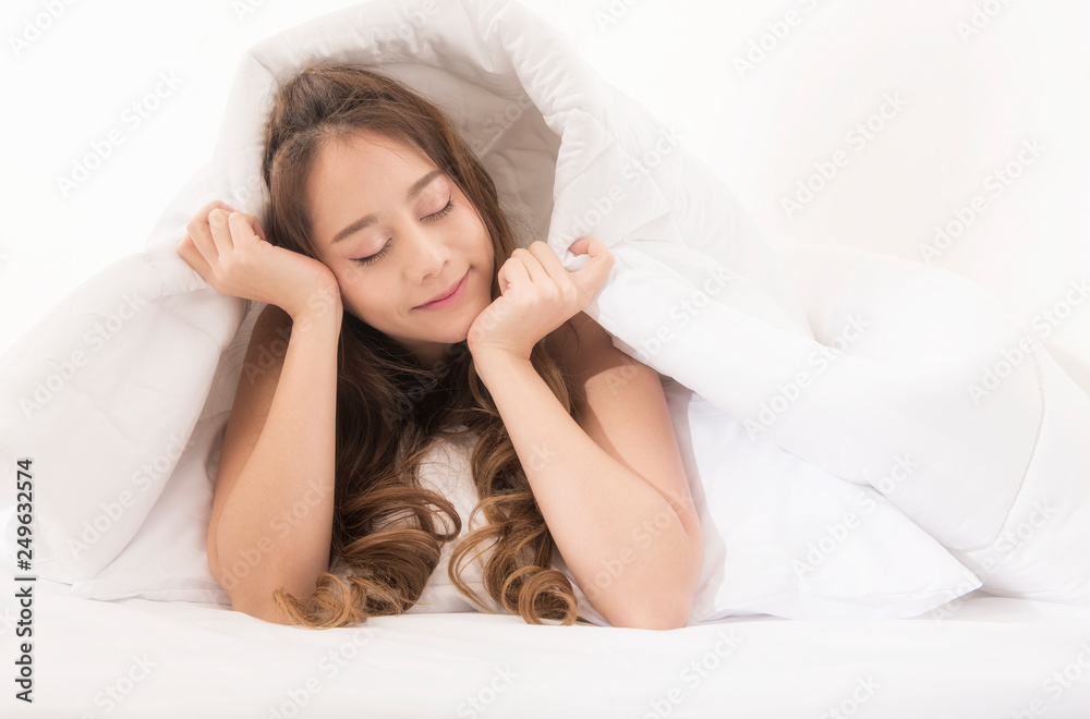 Sleep. Portrait Of Beautiful Female Resting On Comfortable Bed With Pillows In White Bedding In Light Bedroom In Morning. High Quality Image. Sleep. Portrait Of Beautiful Female Resting On Comfortable Bed With Pillows In White Bedding In Light Bedroom In Morning. High Quality Image.