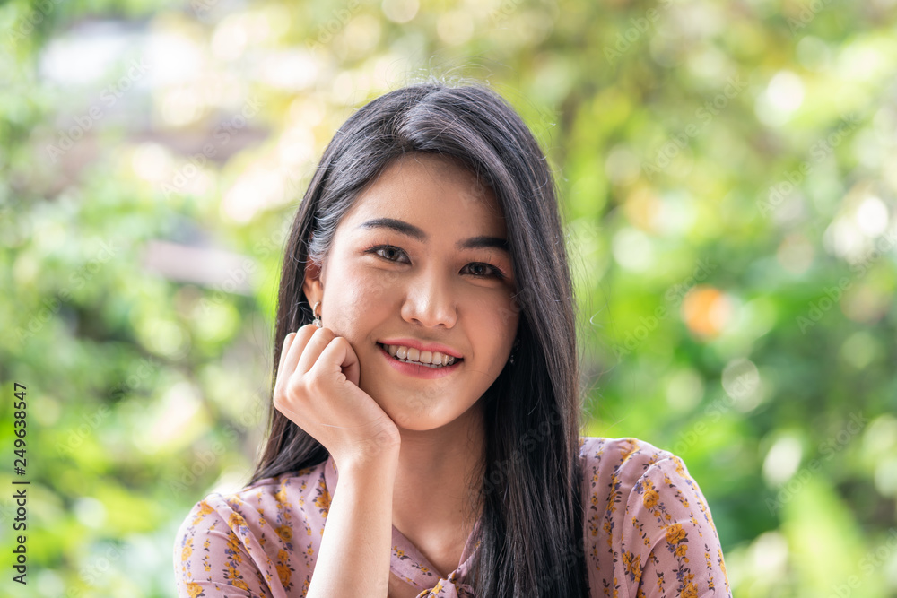 Portrait of wonderful young woman with long hair looking at camera Portrait of wonderful young woman with long hair looking at camera