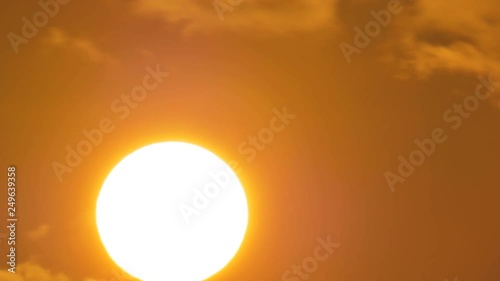 Sunrise timelapse in mountain. Big sun close-uo and clouds motion. Nature composition.