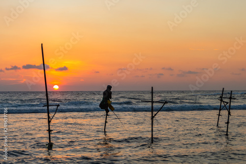 Famous traditional Sri Lankan stilt fishing. Unawatuna, Sri Lanka.