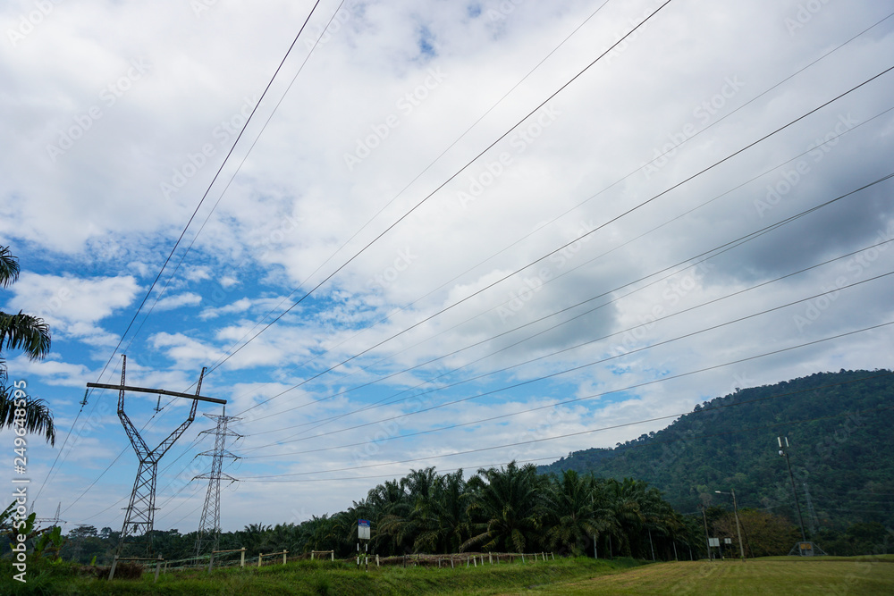 View transmission towers (power tower, electricity pylon, steel lattice tower) cloud blue sky. Texture high voltage pillar, overhead power line, industrial background. - Image View transmission towers (power tower, electricity pylon, steel lattice tower) cloud blue sky. Texture high voltage pillar, overhead power line, industrial background. - Image