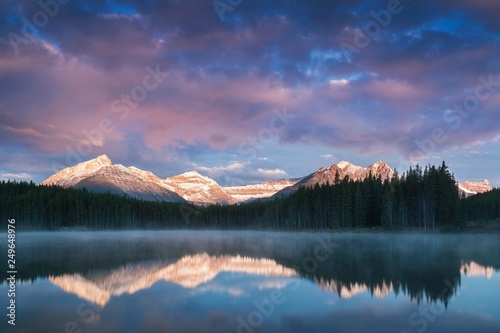 Lake Herbert panorama in a foggy morning with glaciers mountain and reflection in Banff National Park, Canada The Canadian Rockies or Canadian Rocky Mountains. Amazing landscape concept  photo