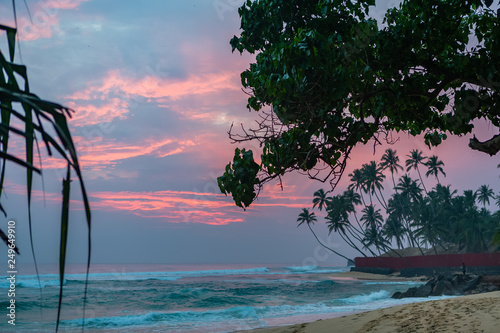 Pink sunset in Unawatuna, Sri Lanka. © mariusltu
