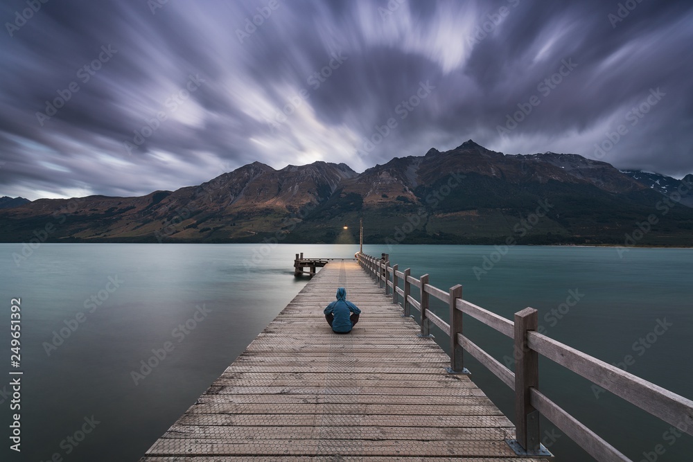 After sunset, the moon is rising at Glenorchy Wharf. Glenorchy is a charming touristic village situated at the Northern end of Lake Wakatipu, otago Region, Queenstown, New Zealand South Island.