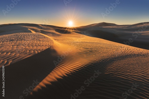 Sunset view of the TePaki Giant Sand Dunes at Cape Reinga  Te Rerenga Wairua   the north westernmost tip of the Aupouri Peninsula  at the northern end of the North Island of New Zealand.