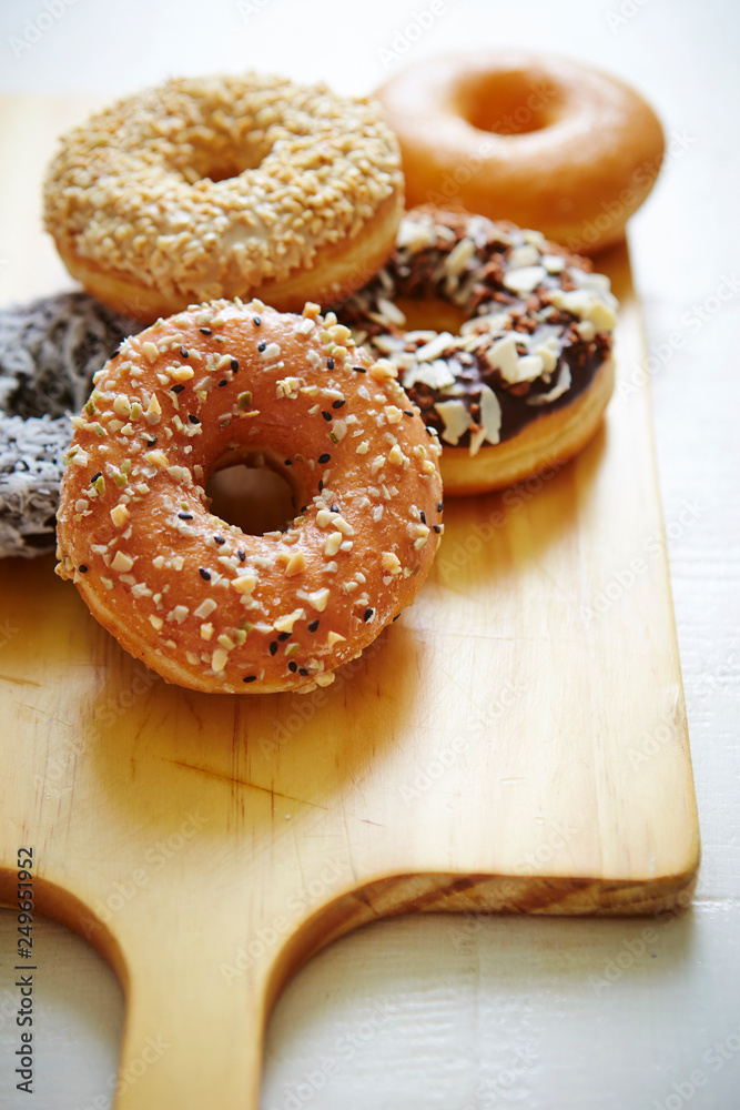 Donuts on wooden board 