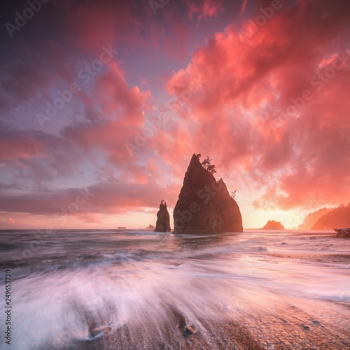 Coastline with sea stacks in sunset time with red and purple light. Rialto Beach in Olympic National Park, Olympic Peninsula near Seattle, Olympia, Port Angeles. Washington. United States of America