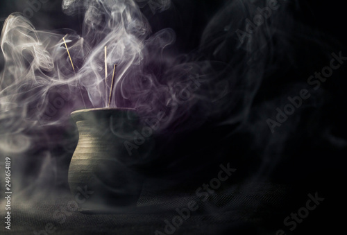 Magical purple smoke, charm, curse photo