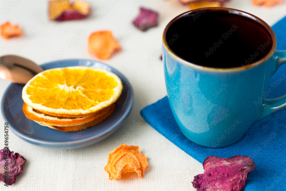 Healthy food organic nutrition. Sliced and dried apple, orange, carrot and beetroot and cup of tea on textile tablecloth. Healthy food organic nutrition. Sliced and dried apple, orange, carrot and beetroot and cup of tea on textile tablecloth.