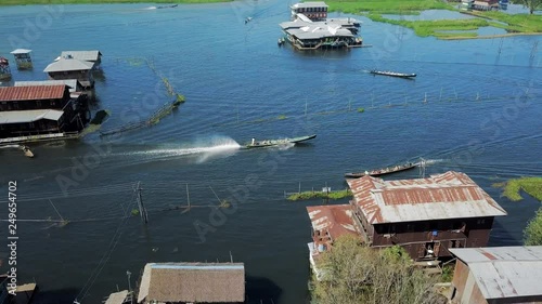 Aerial: Boats Pulling up to Building