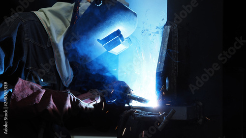 Welder is welding flux cored arc welding ,Industrial welding part in Oil and Gas or Petrochemical