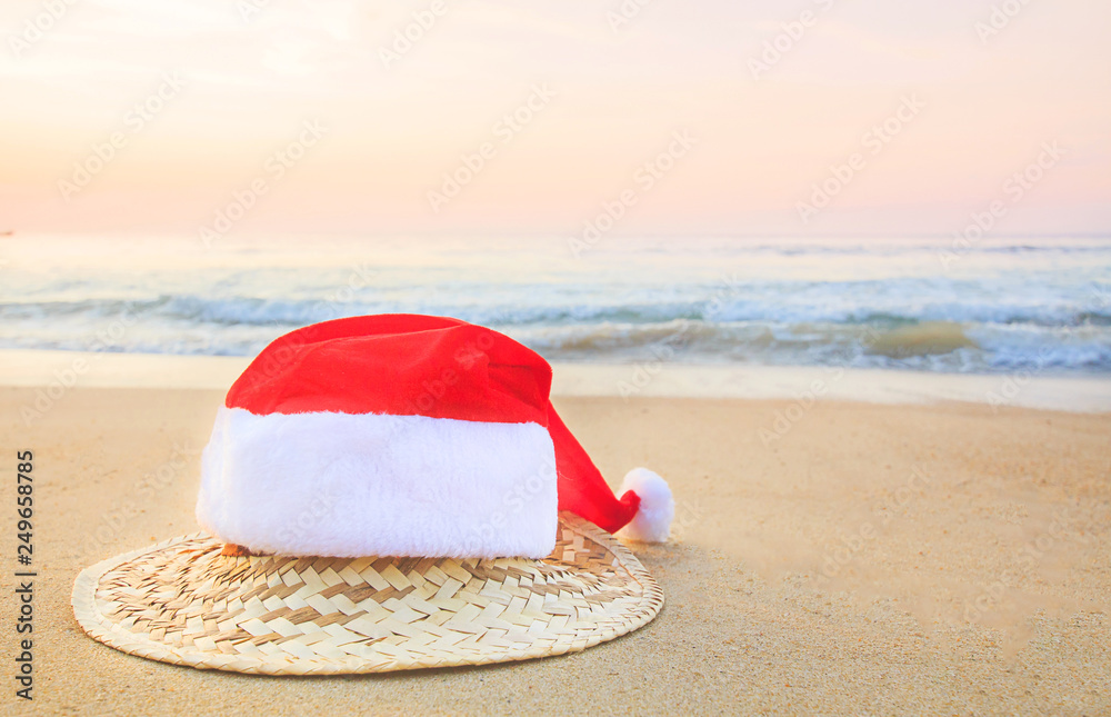 Christmas Santa hat on the beach. are texture Nature background creative tropical layout made at phuket Thailand Christmas Santa hat on the beach. are texture Nature background creative tropical layout made at phuket Thailand