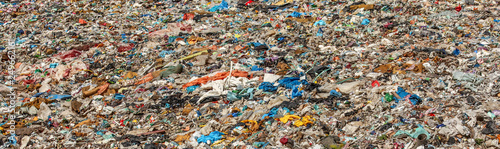 Various garbage on landfill site baner (no logos / trademarks visible on dump stuff)
