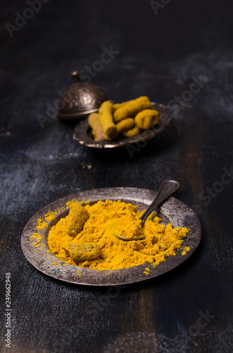 Fresh turmeric root and powder.