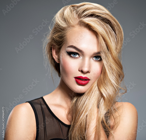 Portrait of  a  beautiful  woman with long white straight  hair
