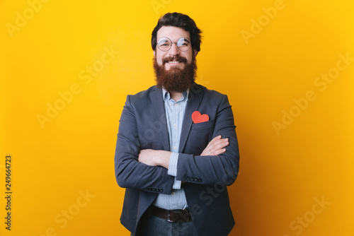 Valentines day, hipster or man with long beard and heart in plaid shirt pocket with crossed hands