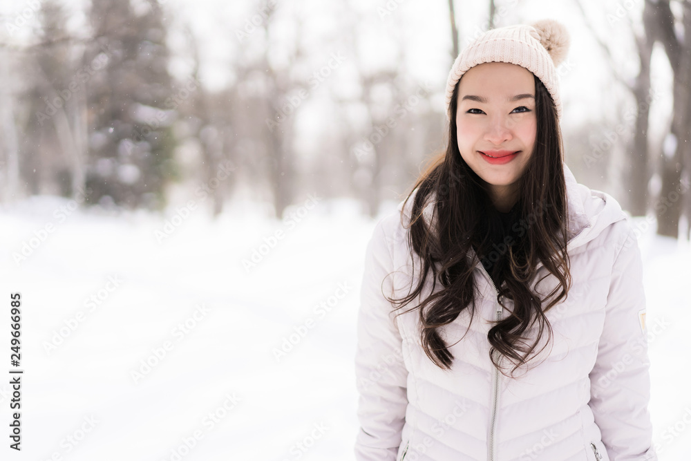 Beautiful young asian woman smiling happy for travel in snow winter season Beautiful young asian woman smiling happy for travel in snow winter season