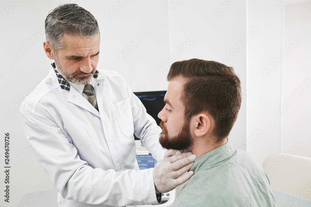 Doctor palpating lymph nodes on neck of patinet. Doctor palpating lymph nodes on neck of patinet.
