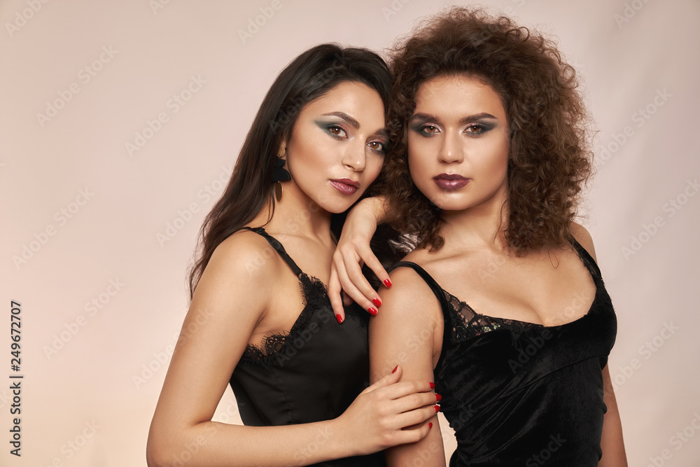 Girls with long hair in black underwear posing. Girls with long hair in black underwear posing.