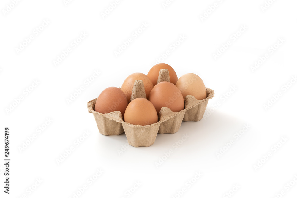 Fresh brown eggs in carton on isolated Fresh brown eggs in carton on isolated