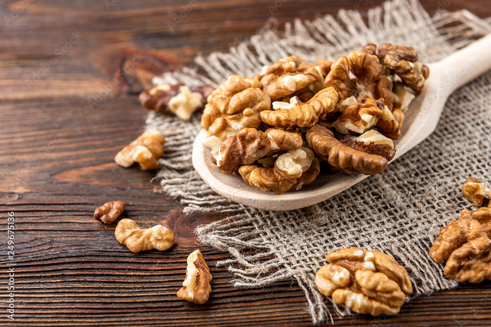 Walnut on dark wooden background. Walnut on dark wooden background.