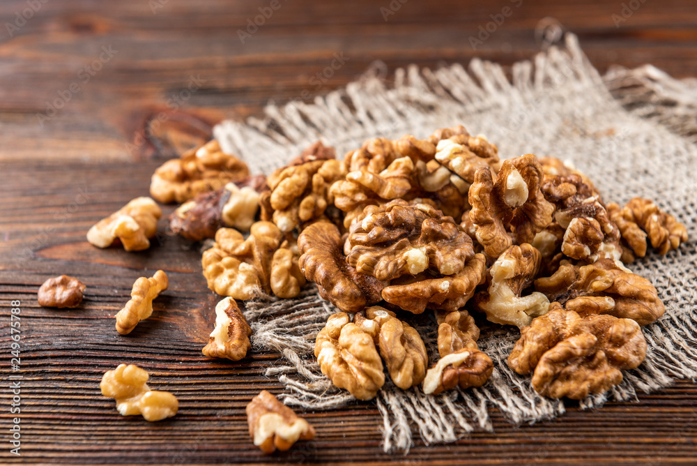 Walnut on dark wooden background. Walnut on dark wooden background.