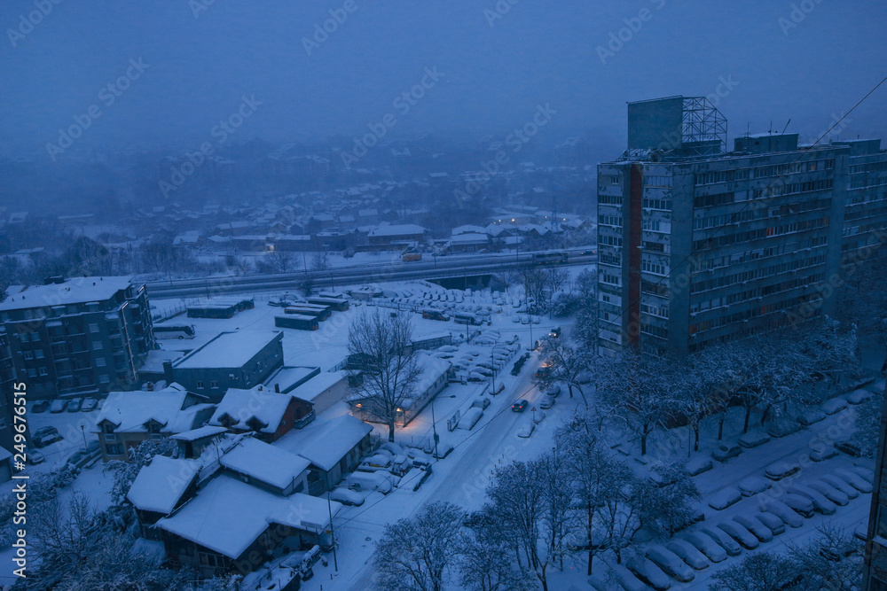 Beautiful winter view of houses and buildings with roofs covered with heavy snow. In snowy season, roof with lot snow because of snow drifting, big snow layer. Winter day, weather, seasons specific.