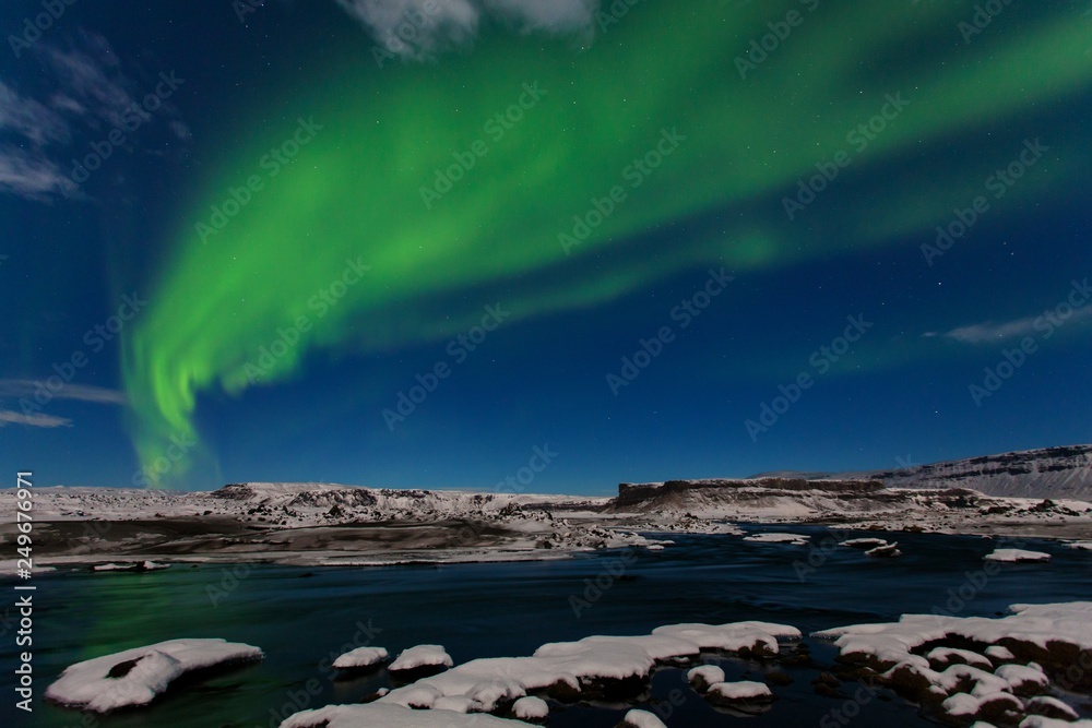 Beautiful panoramic Aurora Borealis or better known as The Northern Lights for background view in Iceland. Jokulsarlon glacier lagoon. Green northern lights Starry sky with polar lights. Arctic circle
