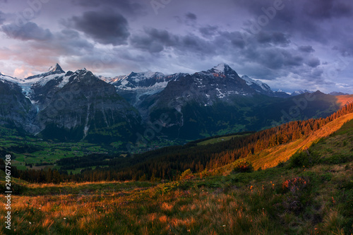 Wonderful scene of the snow rocky mountains. Picturesque morning above village in Swiss Alps, Grindelwald, Bernese oberland, Europe. Nice image of wallpaper. Explore the world´s beauty. Eiger, Monch