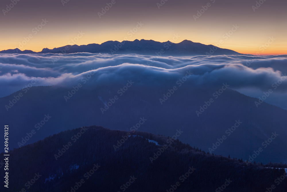 Foggy morning panorama of mountains valley. Few minutes after sunrise in Carpathian mountains, Europe. Beauty of nature concept background. Picturesque sunrise or sunset and gorgeous scene. Nature 