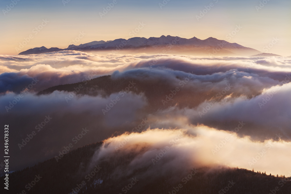 Foggy morning panorama of mountains valley. Few minutes after sunrise in Carpathian mountains, Europe. Beauty of nature concept background. Picturesque sunrise or sunset and gorgeous scene. Nature 