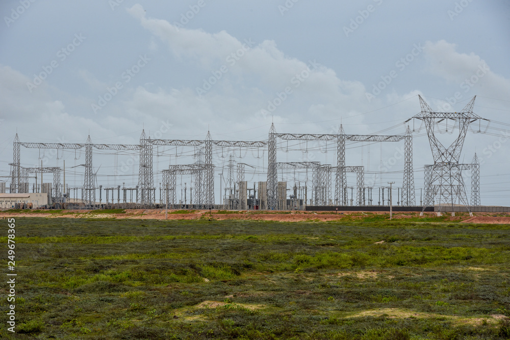 Power station and electric trellis on a field near Atins, Brazil Power station and electric trellis on a field near Atins, Brazil