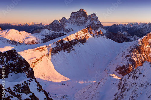 Fantastic sunrise in the Dolomites mountains, South Tyrol, Italy in winter. Italian alpine panorama with steep rocky walls, Monte Pelmo in dramatic light. Christmas or Happ new Year time.
