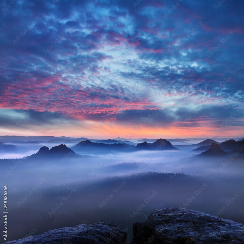 View from viewpoint of Kleiner Winterberg in Saxon at sunrise in the morning fog, National park Saxon Switzerland. Misty morning in Czech-Saxon Switzerland. 