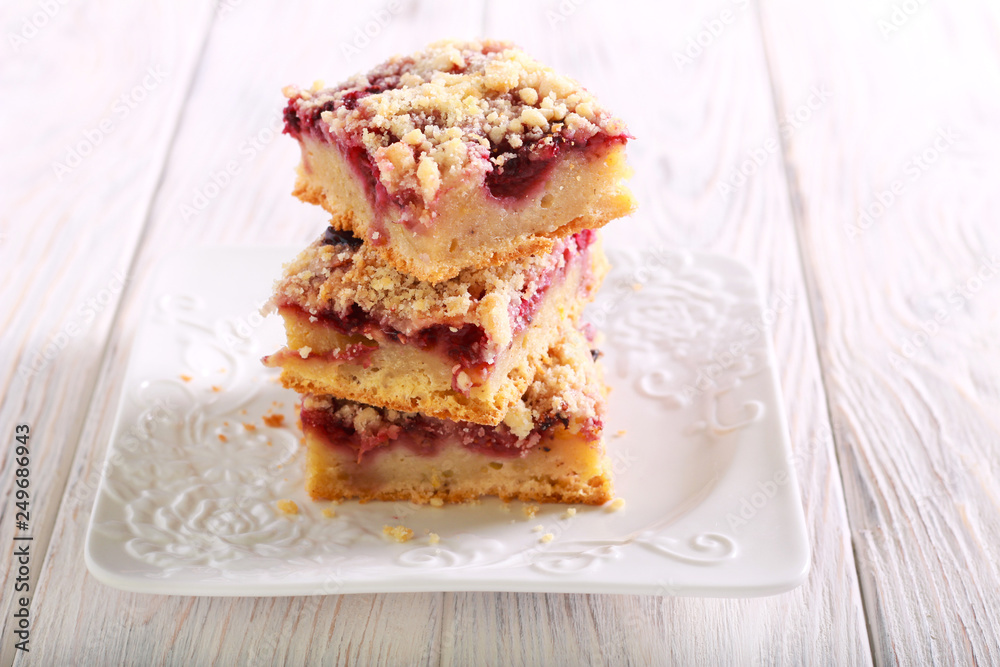 Raspberry crumble bars on plate Raspberry crumble bars on plate