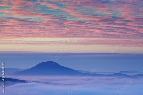 Foggy morning panorama of mountains valley. Splendid summer sunrise in Carpathian mountains, Pieniny, Slovakia, Europe. Beauty of nature concept background. © Michal
