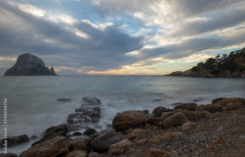 The island of Es Vedra in long exposure at sunset The island of Es Vedra in long exposure at sunset
